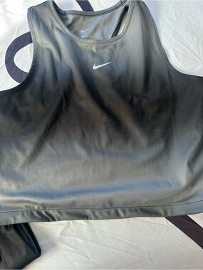 Nike Women’s Racer back The color goes from black, to grey, and a smoke grey